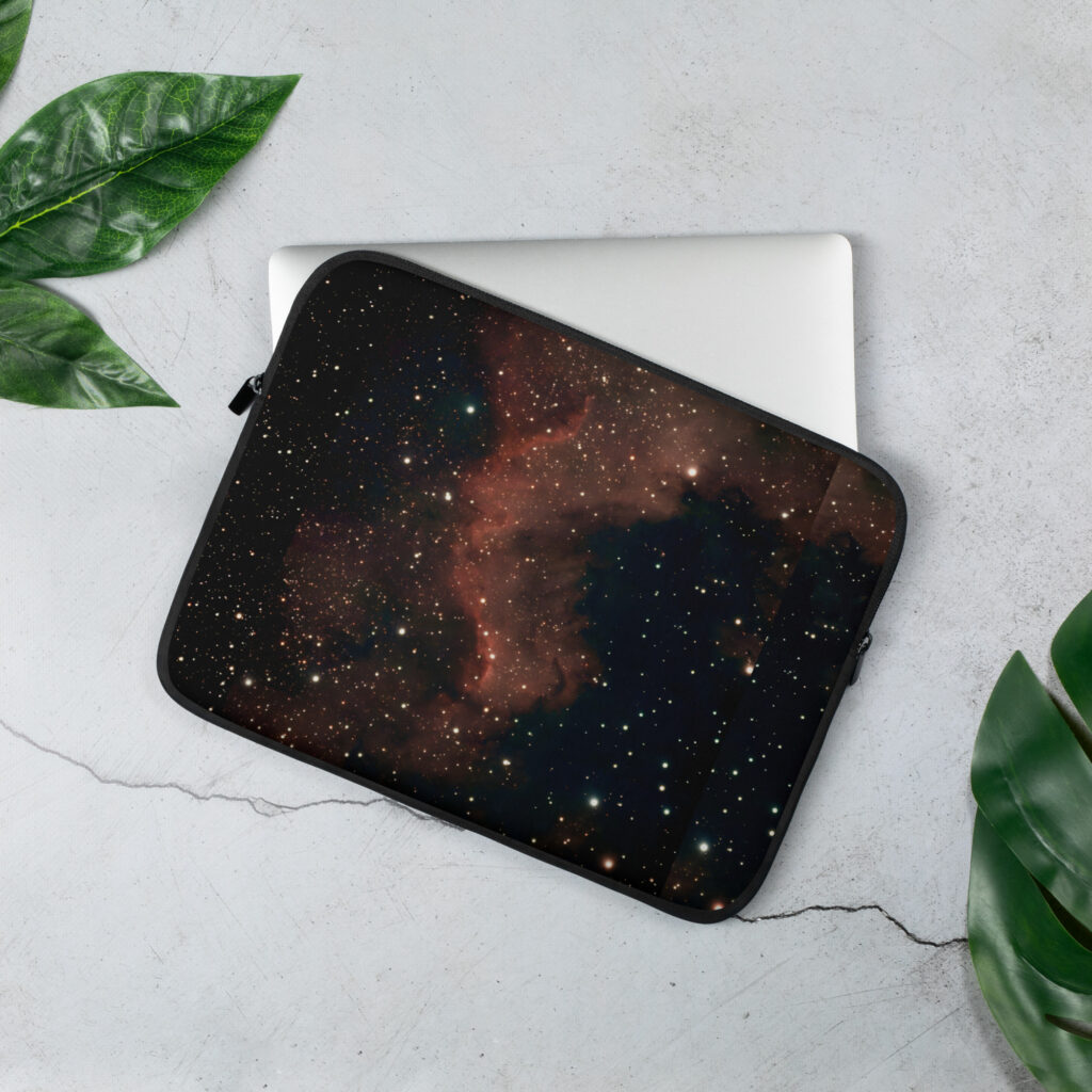Laptop sleeve featuring the North America Nebula (NGC 7000) — a striking red and gold emission nebula in the constellation Cygnus, photographed from the night skies of Tallinn, Estonia